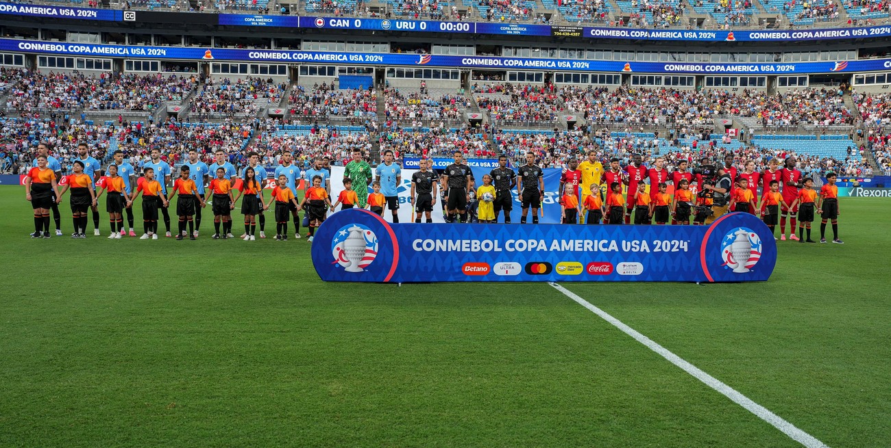 Jul 13, 2024; Charlotte, NC, USA; Teams from Canada and Uruguay take the field during the first half at Bank of America Stadium. Mandatory Credit: Jim Dedmon-USA TODAY Sports