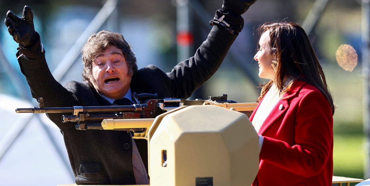 Argentina's President Javier Milei gestures from a military vehicle next to Vice President Victoria Villarruel, during a military parade commemorating the 208th anniversary of the country's independence from Spain in 1816, in Buenos Aires, Argentina July 9, 2024. REUTERS/Matias Baglietto