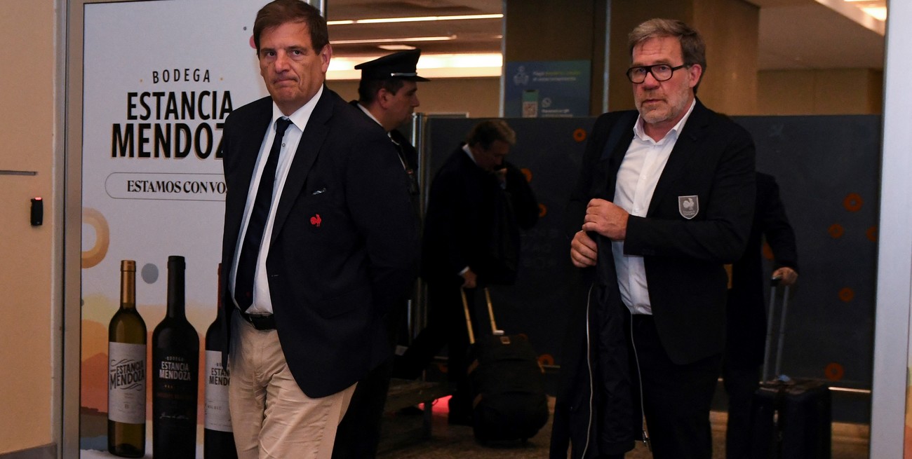 Florian Grill President of the French Federation of Rugby and Jean-Marc Lhermet, Vice-President walk outside the airport in Mendoza, Argentina July 10, 2024. REUTERS/Ramiro Gomez
