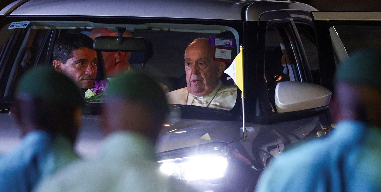 Pope Francis sits in a car after landing at Port Moresby Jackson International Airport, in Port Moresby, Papua New Guinea, September 6, 2024. REUTERS/Guglielmo Mangiapane
