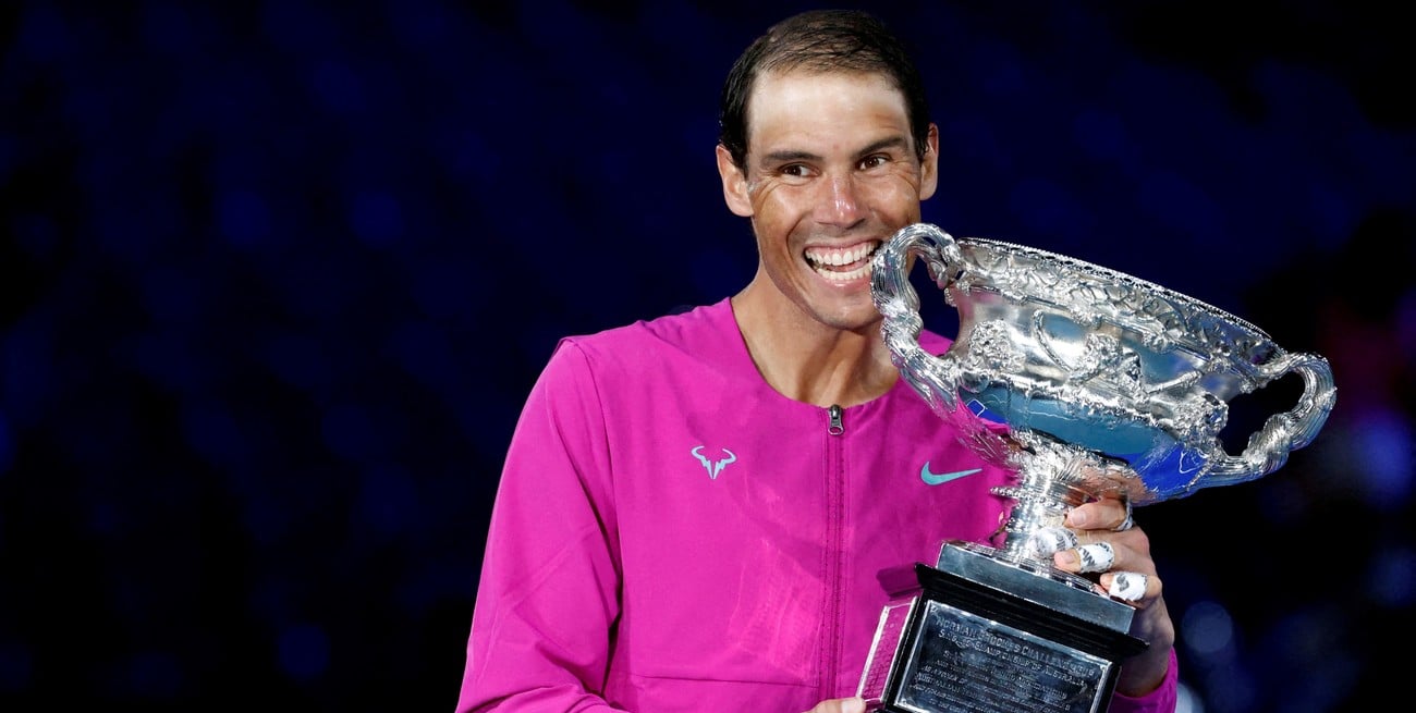 FILE PHOTO: Tennis - Australian Open - Men's Singles Final - Melbourne Park, Melbourne, Australia - January 31, 2022
Spain's Rafael Nadal celebrates after winning the men's singles final with trophy REUTERS/Asanka Brendon Ratnayake/File Photo