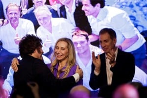 Argentina's President Javier Milei embraces his sister Karina Milei after the La Libertad Avanza party won the midterm election, which is seen as crucial for Milei's administration after U.S. President Donald Trump warned that future support for Argentina would depend on Milei's party performing well in the vote, in Buenos Aires, Argentina, October 26, 2025. REUTERS/Cristina Sille