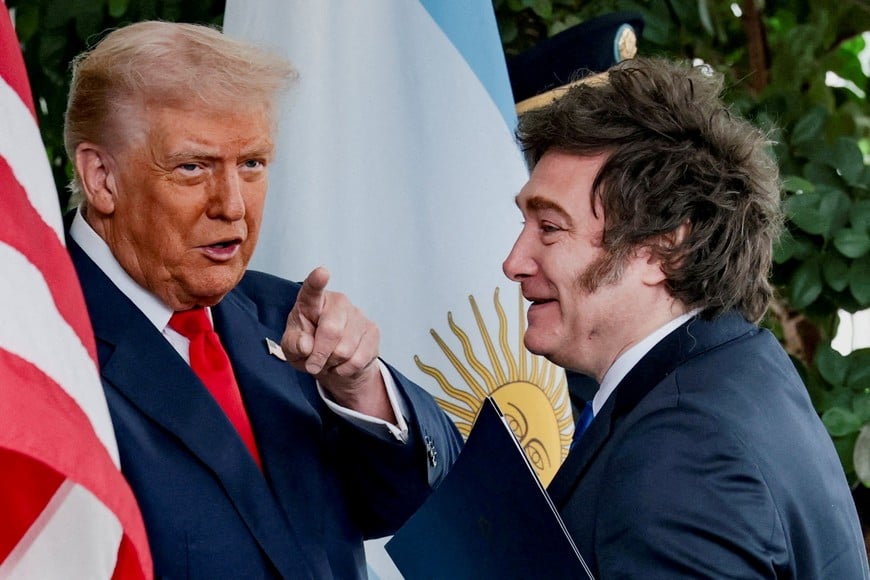 FILE PHOTO: U.S. President Donald Trump points a finger as he welcomes Argentina's President Javier Milei at the White House in Washington, D.C., U.S., October 14, 2025. REUTERS/Jonathan Ernst/File Photo