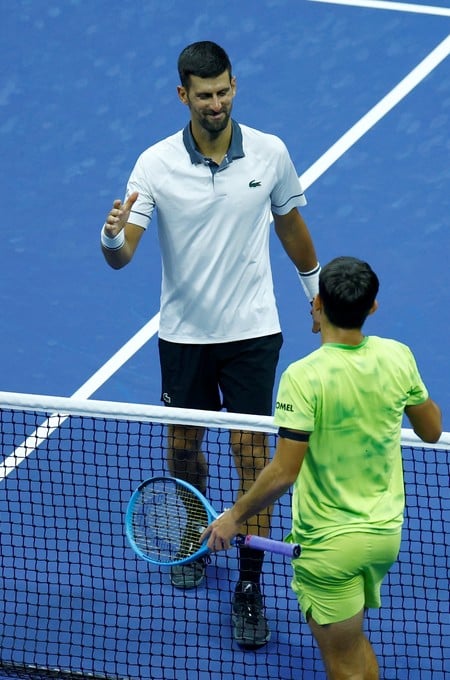 Tennis - U.S. Open - Flushing Meadows, New York, United States - August 30, 2026
Serbia's Novak Djokovic shakes hands with Argentina's Mariano Navone after losing his first round match REUTERS/Jeenah Moon