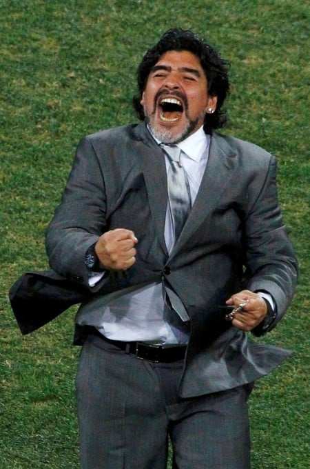 FILE PHOTO: Argentina's coach Diego Maradona celebrates after Carlos Tevez scored a goal during a 2010 World Cup second round soccer match against Mexico at Soccer City stadium in Johannesburg June 27, 2010. REUTERS/David Gray (SOUTH AFRICA - Tags: SPORT SOCCER WORLD CUP)/File Photo
