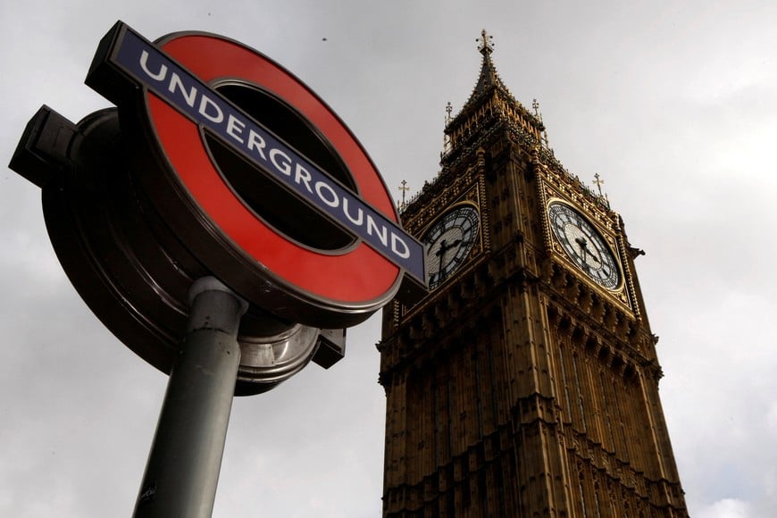 FILE PHOTO: An London Underground station sign is seen in front of the Big Ben clocktower in central London October 3, 2010.   REUTERS/Luke MacGregor/File Photo