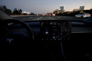 A Tesla Model 3 vehicle is shown driving using Full Self Driving (FSD) beta software on a California highway near Irvine, California, U.S., February 7, 2023. Tesla Inc TSLA.O said it would recall 362,000 U.S. vehicles to update its Full Self-Driving (FSD) Beta software after U.S. regulators said on Thursday the driver assistance system did not adequately adhere to traffic safety laws and could cause crashes.       REUTERS/Mike Blake