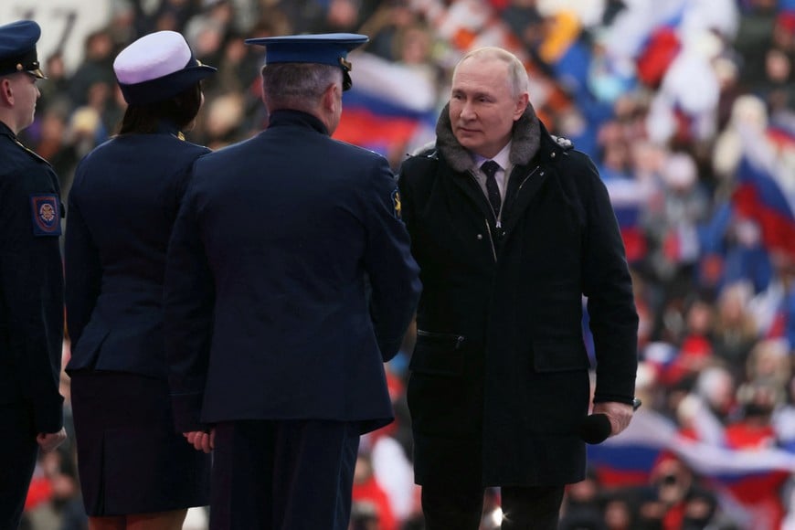 Russian President Vladimir Putin attends a concert dedicated to Russian service members involved in the country's military campaign in Ukraine, on the eve of the Defender of the Fatherland Day at Luzhniki Stadium in Moscow, Russia February 22, 2023. Sputnik/Mikhail Metzel/Pool via REUTERS ATTENTION EDITORS - THIS IMAGE WAS PROVIDED BY A THIRD PARTY.