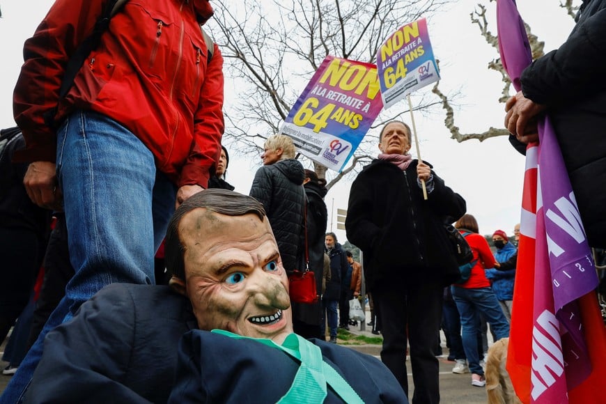 A puppet figure depicting French President Emmanuel Macron is seen as protesters attend a demonstration to protest the use of the article 49.3, a special clause in the French Constitution, to push the pensions reform bill through the National Assembly without a vote by lawmakers, by French government, in Nice, France, March 19, 2023. REUTERS/Eric Gaillard