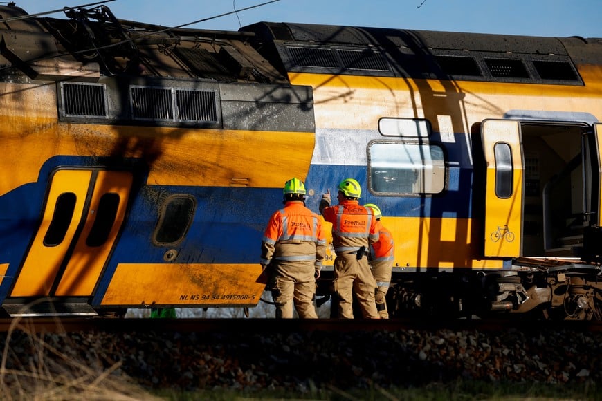 Emergency service personnel work at the site where a passenger train derailed in Voorschoten, Netherlands April 4, 2023. REUTERS/Toby Sterling