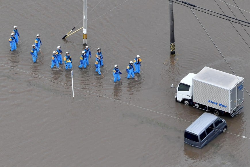 Rescue operations are underway as vehicles are left in floodwaters following heavy rain brought about by Typhoon Mawar, in this photo taken from a Kyodo News helicopter, in Toyokawa, Aichi Prefecture, central Japan in this photo taken by Kyodo on June 3, 2023.  Mandatory credit Kyodo/via REUTERS ATTENTION EDITORS - THIS IMAGE WAS PROVIDED BY A THIRD PARTY. MANDATORY CREDIT. JAPAN OUT. NO COMMERCIAL OR EDITORIAL SALES IN JAPAN     TPX IMAGES OF THE DAY