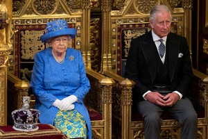 FILE PHOTO: Britain's Queen Elizabeth sits next to Prince Charles during the State Opening of Parliament in central London, Britain June 21, 2017.  Stefan Rousseau/Pool via REUTERS/File Photo