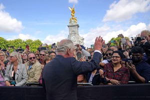 King Charles III is greeted by well-wishers during a walkabout to view tributes left outside Buckingham Palace, London, following the death of Queen Elizabeth II on Thursday. Picture date: Friday September 9, 2022. Yui Mok/Pool via REUTERS
