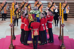 The Bearer Party from Queen's Company, 1st Battalion Grenadier Guards, places the coffin of Queen Elizabeth II on the catafalque Westminster Hall, London, where it will lie in state ahead of her funeral on Monday. Picture date: Wednesday September 14, 2022.   Yui Mok/Pool via REUTERS