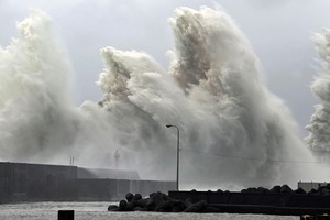 High waves triggered by Typhoon Nanmadol are seen at a fishing port in Aki, Kochi Prefecture, western Japan, September 19, 2022, in this photo taken by Kyodo. Mandatory credit Kyodo via REUTERS ATTENTION EDITORS - THIS IMAGE WAS PROVIDED BY A THIRD PARTY. MANDATORY CREDIT. JAPAN OUT. NO COMMERCIAL OR EDITORIAL SALES IN JAPAN