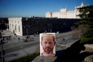 A Spanish copy of Britain's Prince Harry, Duke of Sussex's book 'Spare' is pictured in this illustration image outside the Royal Palace in Madrid, Spain, January 5, 2023. REUTERS/Juan Medina/Illustration