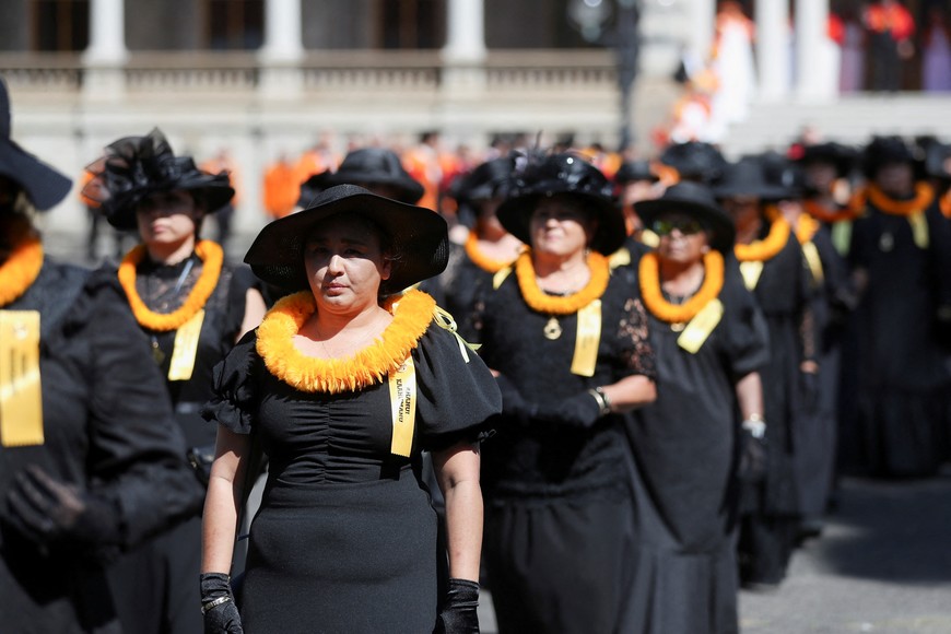 Members of the Hale O Na Ali’i O Hawaii line up for a memorial honouring of Abigail Kawananakoa, who died December 11, 2022 at the age of 96 and was considered a princess for her royal heritage, in front of Iolani Palace where she will lie in state, in Honolulu, Hawaii, U.S. January 22, 2023. REUTERS/Marco Garcia