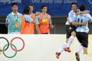 AFP Ezequiel Lavezzi (L) of Argentina celebrates with teammate Angel Di Maria after scoring a goal against Australia during their men's first round group A football match of the 2008 Beijing Olympic Games at the Shanghai Stadium on August 10, 2008. Argentina defeated Australia by 1-0.  AFP PHOTO/LIU Jin