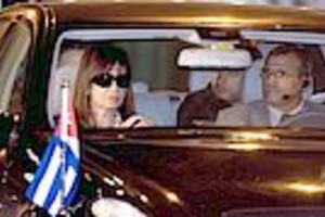 AFP Argentina's President Cristina Fernandez de Kichner (L) leaves the Jose Marti International airport in Havana in an official car after arrival on January 18, 2009. The visit, postponed last week due to Fernandez's health problems, will serve to "strengthen the ties of friendship and cooperation that characterize relations between the governments and people of both nations," said the statement published on the front pages of Cuba's nationwide newspapers Granma and Juventud Rebelde.     AFP PHOTO/Adalberto Roque