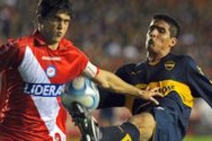 AFP Boca Juniors' Lucas Viatri (R) vies for the ball with Matias Caruzzo of Argentinos Juniors during their Argentina first division football match at Diego Armando Maradona stadium in Buenos Aires on September 17, 2008. AFP PHOTO/Alejandro PAGNI