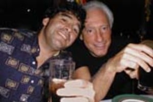 JORGE SILVA Former Argentine soccer star Diego Maradona (L), who survived a dramatic car crash in Cuba this week, celebrates his lucky escape with his manager Guillermo Coppola in a Havana restaurant Friday night, September 15, 2000. Maradona and a friend escaped unhurt in the crash, in which the soccer idol's jeep collided head-on with a tourist bus outside Havana late September. REUTERS/str