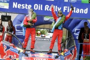 AFP Frenchman Sebastien Loeb (R) driving a Citroen C4 celebrates his win with his co-driver Daniel Elena on the podium in Jyvaskyla Paviljonki in WRC Rally of Finland in Central Finland on August 3, 2008. T he four-time world champion finished nine seconds ahead of Finland's Mikko Hirvonen in a Ford Focus, with Australia's Chris Atkinson finishing third three minutes off the pace in a Subaru Impreza.AFP PHOTO / LEHTIKUVA / Roope Salonen   FINLAND OUT