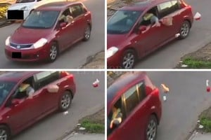 ELLITORAL_218282 |  Periodismo Ciudadano Las imágenes muestran al conductor de un auto que arroja los desperdicios en plena calle.