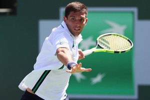 ELLITORAL_203313 |  Julian Finney INDIAN WELLS, CA - MARCH 14:  Federico Delbonis of Argentina in action against Andy Murray of Great Britain during day eight of the BNP Paribas Open at Indian Wells Tennis Garden on March 14, 2016 in Indian Wells, California.  (Photo by Julian Finney/Getty Images)
