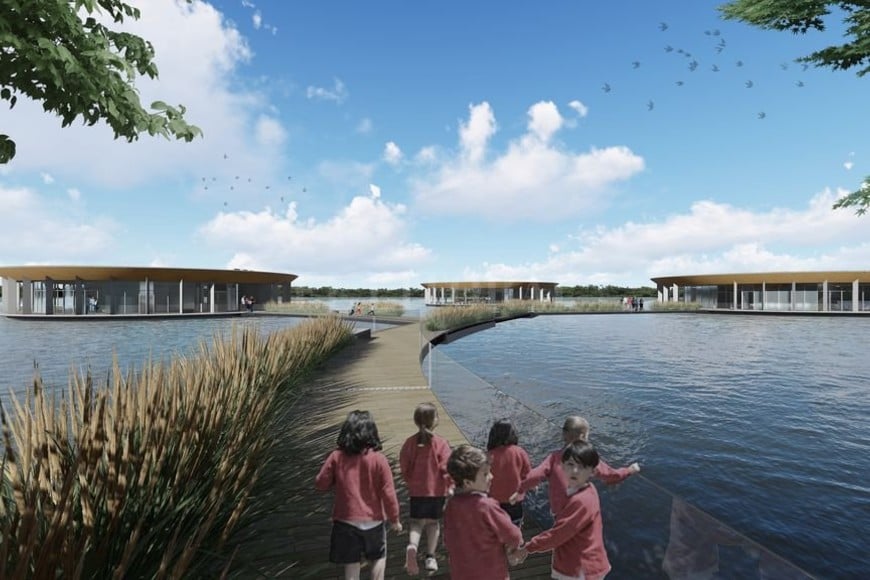 ELLITORAL_248427 |  Gentileza Acceso. Vista de una pasarela flotante tipo marina con baranda para llegar a los tres irupé que se ubicarían dentro de una laguna de la isla.