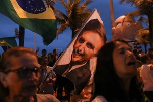 ELLITORAL_225383 |  DPA Simpatizantes de Bolsonaro celebran tras conocerse los primeros resultados de las elecciones presidenciales en Brasil.