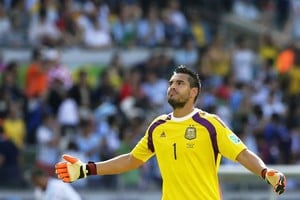 Archivo / Dennis Sabangan . Belo Horizonte (Brazil), 21/06/2014.- Goalkeeper Sergio Romero of Argentina reacts during the FIFA World Cup 2014 group F preliminary round match between Argentina and Iran at the Estadio Mineirao in Belo Horizonte, Brazil, 21 June 2014.
(RESTRICTIONS APPLY: Editorial Use Only, not used in association with any commercial entity - Images must not be used in any form of alert service or push service of any kind including via mobile alert services, downloads to mobile devices or MMS messaging - Images must appear as still images and must not emulate match action video footage - No alteration is made to, and no text or image is superimposed over, any published image which: (a) intentionally obscures or removes a sponsor identification image; or (b) adds or overlays the commercial identification of any third party which is not officially associated with the FIFA World Cup) (Brasil, Mundial de Fútbol) EFE/EPA/DENNIS SABANGAN EDITORIAL USE ONLY