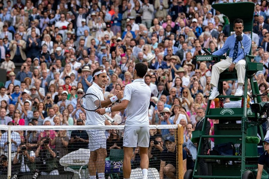 ELLITORAL_259980 |  AELTC/Ben Solomon Novak Djokovic (SRB) celebrates as he wins against Roger Federer (SUI) in the final of the Gentlemen's Singles on Centre Court. The Championships 2019. Held at The All England Lawn Tennis Club, Wimbledon. Day 13 Sunday 14/07/2019. Credit: AELTC/Ben Solomon
