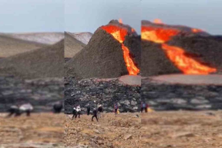 ELLITORAL_366456 |  Captura de video El volcán Fagradalsfjall hace erupción mientras juegan Vóleibol con una pelota.