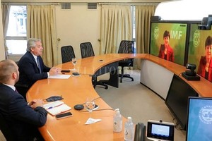 ELLITORAL_437457 |  Archivo El presidente Alberto Fernández y el ministro de Economía, Martín Guzmán, negocian con Kristalina Gerogieva, gerenta del FMI. Unos y otros se las ingenian para no informar el verdadero costo de los intereses.