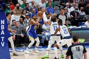 May 24, 2022; Dallas, Texas, USA; Golden State Warriors guard Moses Moody (4) shoots the ball against Dallas Mavericks guard Jalen Brunson (13) during the fourth quarter in game four of the 2022 Western Conference finals at American Airlines Center. Mandatory Credit: Kevin Jairaj-USA TODAY Sports