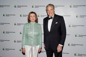 FILE PHOTO: Speaker of the House Nancy Pelosi, D-CA and her husband Paul Pelosi arrive for the formal Artist's Dinner honoring the recipients of the 44th Annual Kennedy Center Honors at the Library of Congress in Washington, D.C., U.S., December 4, 2021. REUTERS/Ken Cedeno/File Photo