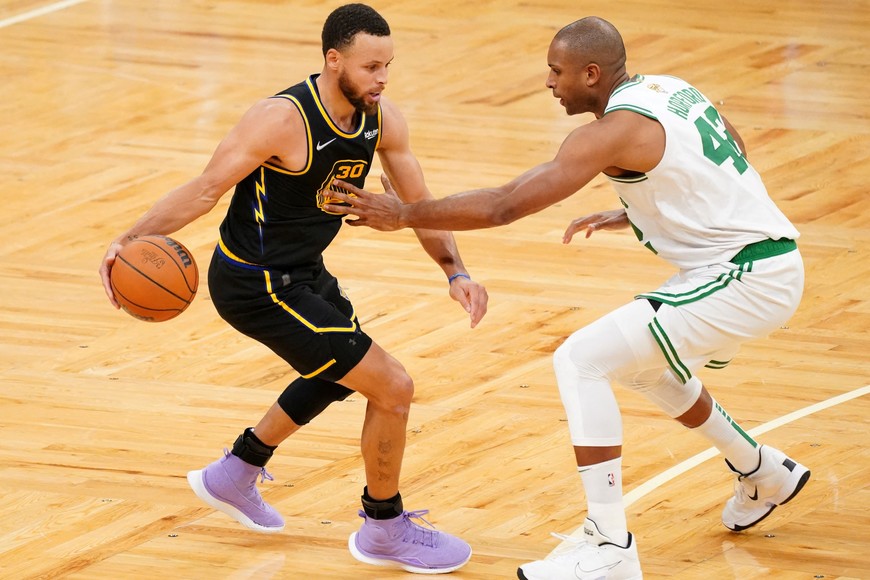 Jun 10, 2022; Boston, Massachusetts, USA; Boston Celtics center Al Horford (42) defends Golden State Warriors guard Stephen Curry (30) during the fourth quarter of game four in the 2022 NBA Finals at the TD Garden. Mandatory Credit: David Butler II-USA TODAY Sports