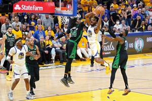 Jun 13, 2022; San Francisco, California, USA; Golden State Warriors forward Andrew Wiggins (22) goes to the basket while defended by Boston Celtics center Robert Williams III (44) during the second half in game five of the 2022 NBA Finals at Chase Center. Mandatory Credit: Kyle Terada-USA TODAY Sports