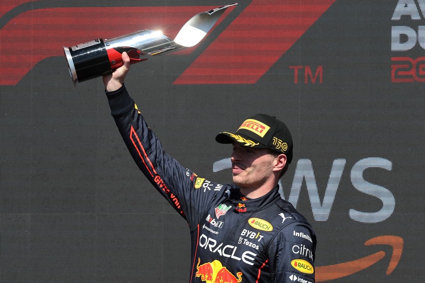 Formula One F1 - Canadian Grand Prix - Circuit Gilles Villeneuve, Montreal, Canada - June 19, 2022
Red Bull's Max Verstappen celebrates with a trophy on the podium after winning the race REUTERS/Chris Helgren