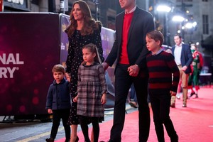 FILE PHOTO: Britain's Prince William, Catherine, Duchess of Cambridge and their children, Prince Louis, Princess Charlotte and Prince George attend a special pantomime performance hosted by The National Lottery, to thank key workers and their families for their efforts throughout the COVID-19 pandemic at London's Palladium Theatre, London, Britain December 11, 2020. Aaron Chown/Pool via REUTERS/File Photo