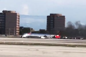 A video shows a plane at Miami International Airport after an emergency landing, in this screengrab obtained by Reuters from a social media video, June 21, 2022. Video obtained via REUTERS THIS IMAGE HAS BEEN SUPPLIED BY A THIRD PARTY. MANDATORY CREDIT. NO RESALES. NO ARCHIVES.