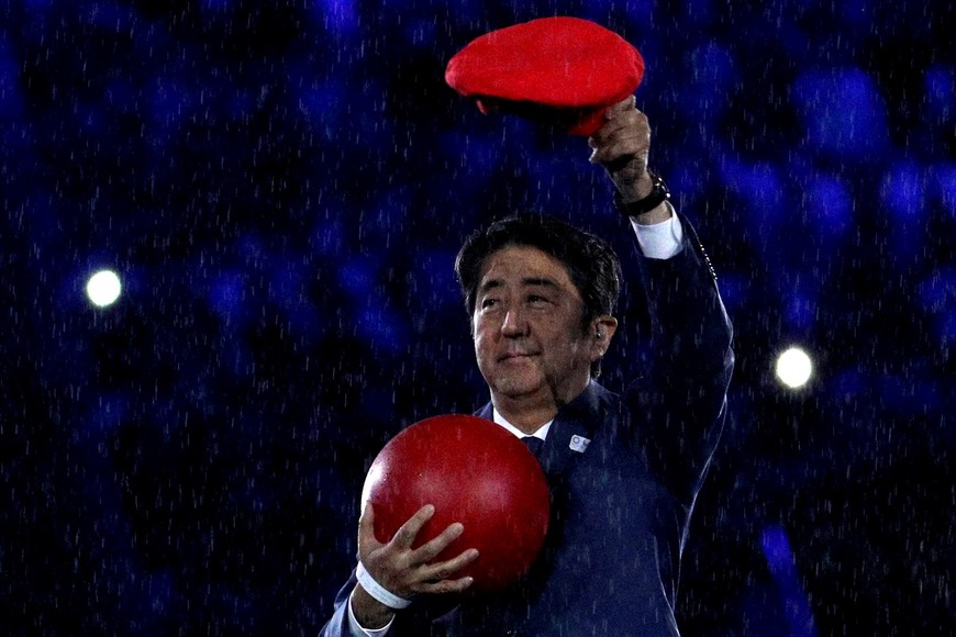 FILE PHOTO: 2016 Rio Olympics - Closing ceremony - Maracana - Rio de Janeiro, Brazil - 21/08/2016. Japanese Prime Minister Shinzo Abe takes part in the closing ceremony.  REUTERS/Stoyan Nenov/File Photo