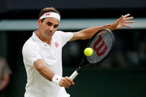 FILE PHOTO: Tennis - Wimbledon - All England Lawn Tennis and Croquet Club, London, Britain - July 5, 2021 Switzerland's Roger Federer in action. REUTERS/Paul Childs/File Photo
