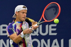 Aug 9, 2022; Montreal, QC, Canada; Diego Schwartzman (ARG) hits a backhand against Alejandro Davidovich Fokina (ESP) in first round play in the National Bank Open at IGA Stadium. Mandatory Credit: Eric Bolte-USA TODAY Sports