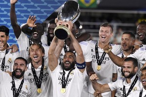 Soccer Football - European Super Cup - Real Madrid v Eintracht Frankfurt - Helsinki Olympic Stadium, Helsinki, Finland - August 10, 2022
Real Madrid's Karim Benzema lifts the trophy as he celebrates with teammates after winning the European Super Cup  
Jussi Nukari/Lehtikuva via REUTERS

ATTENTION EDITORS - THIS IMAGE WAS PROVIDED BY A THIRD PARTY. NO THIRD PARTY SALES. NOT FOR USE BY REUTERS THIRD PARTY DISTRIBUTORS. FINLAND OUT. NO COMMERCIAL OR EDITORIAL SALES IN FINLAND.