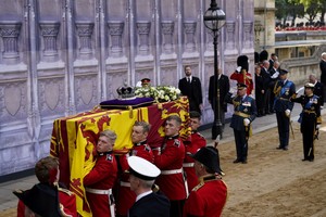 King Charles III, the Princess Royal and the Prince of Wales, salute as the bearer party carry the coffin of Queen Elizabeth II into Westminster Hall, London, where it will lie in state ahead of her funeral on Monday. Picture date: Wednesday September 14, 2022. Danny Lawson/Pool via REUTERS
