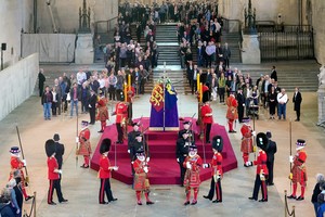 Members of the public file past the coffin of Queen Elizabeth II, draped in the Royal Standard with the Imperial State Crown and the Sovereign's orb and sceptre, lying in state on the catafalque in Westminster Hall, at the Palace of Westminster, London, ahead of her funeral on Monday. Picture date: Thursday September 15, 2022.    Yui Mok/Pool via REUTERS