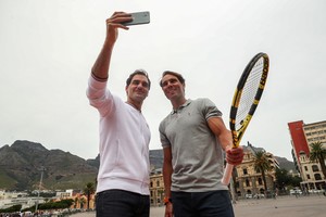 Roger Federer and Rafael Nadal take a selfie in front of Cape Town's iconic Table Mountain during a photo session ahead of their "Match in Africa" exhibition tennis match in Cape Town, South Africa, February 7, 2020. REUTERS/Mike Hutchings