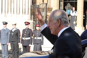 King Charles III waves to members of the public while on a walkabout in Writer's Square, Belfast, during his visit to Northern Ireland. Picture date: Tuesday September 13, 2022.    Liam McBurney/Pool via REUTERS