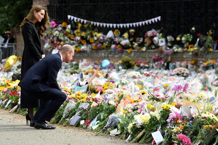 Britain's William, Prince of Wales and Catherine, Princess of Wales, look at floral tributes, following the death of Britain's Queen Elizabeth, at Sandringham Estate in eastern England, Britain, September 15, 2022. REUTERS/Toby Melville/Pool